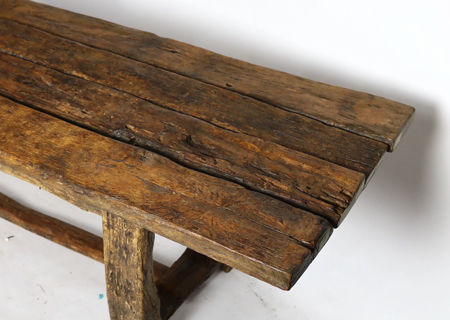 A rustic oak four plank top refectory table, length 320cm, width 78cm, height 78.5cm